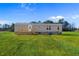 Gray house exterior with wooden deck and steps, spacious lawn at 5988 Pleasant View Church Rd., Nichols, SC 29581