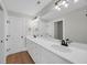 Bathroom features a long vanity with double sinks, quartz countertops, and sleek black fixtures at 604 Mccown Dr., Conway, SC 29526