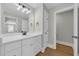 Bathroom with white vanity, vinyl flooring, silver hardware, and recessed lighting at 604 Mccown Dr., Conway, SC 29526