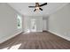 Spacious bedroom with neutral carpet, a ceiling fan and an ensuite bathroom at 604 Mccown Dr., Conway, SC 29526