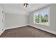 Cozy bedroom featuring plush brown carpeting and a bright window with natural light and views at 604 Mccown Dr., Conway, SC 29526