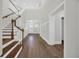 Two-story foyer with hardwood stairs and floors, with views to the front door at 604 Mccown Dr., Conway, SC 29526