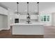 Spacious kitchen featuring a large island with pendant lighting and stainless steel appliances at 604 Mccown Dr., Conway, SC 29526