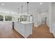 Bright kitchen with island, pendant lighting, stainless appliances, and open floor plan at 604 Mccown Dr., Conway, SC 29526