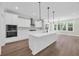 Modern kitchen features stainless steel appliances, large island, and seamless access to dining area at 604 Mccown Dr., Conway, SC 29526