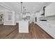Open kitchen with white cabinets, stainless appliances, quartz counters, and a center island at 604 Mccown Dr., Conway, SC 29526