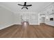 Bright living room with hardwood floors, open staircase, and natural light throughout the space at 604 Mccown Dr., Conway, SC 29526