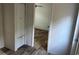 Hallway with wood-look floors and access to bedrooms at 1412 Seagull Blvd., North Myrtle Beach, SC 29582