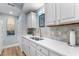 Modern kitchen features white cabinets, stainless steel appliances and a clean quartz countertop at 1969 Governors Landing Rd. # 224, Murrells Inlet, SC 29576