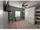 Bedroom with built-in white cabinets and pink rug at 233 Cloverleaf Dr., Longs, SC 29568