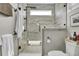 Updated bathroom features a glass-enclosed shower with tile, modern fixtures, and a neutral color palette at 253 W Second Ave. S, Ocean Isle Beach, NC 28469