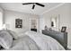 Bright bedroom featuring modern decor, natural light and an ensuite bathroom at 253 W Second Ave. S, Ocean Isle Beach, NC 28469