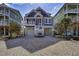 Beautiful home with an elevated structure, a garage and ample parking, perfect for coastal living at 253 W Second Ave. S, Ocean Isle Beach, NC 28469