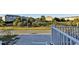Scenic view of the property's entrance, showing the driveway and partial view of the surrounding neighborhood at 253 W Second Ave. S, Ocean Isle Beach, NC 28469