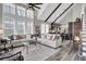 Spacious living area flows into kitchen and features high ceilings and ample natural light from large windows at 253 W Second Ave. S, Ocean Isle Beach, NC 28469