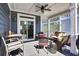 Relaxing screened porch with wicker seating, ideal for outdoor entertaining and leisure at 253 W Second Ave. S, Ocean Isle Beach, NC 28469