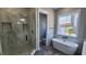 Elegant bathroom with soaking tub, walk-in shower, and marble finishes at 3057 Moss Bridge Ln., Myrtle Beach, SC 29579