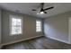 This bedroom features two large windows offering plentiful natural light at 3057 Moss Bridge Ln., Myrtle Beach, SC 29579