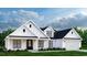 Charming exterior of a modern farmhouse featuring white siding, black trim, and a well-manicured lawn at 681 Hawthorn Dr., Pawleys Island, SC 29585
