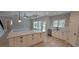 Stylish kitchen with a central island, stainless steel appliances, and a view of the backyard through the windows at 681 Hawthorn Dr., Pawleys Island, SC 29585