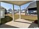 Covered back porch overlooking a well-maintained backyard and surrounding neighborhood at 718 Macon Alley, Myrtle Beach, SC 29588