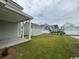 Well-manicured backyard and patio with a view of neighboring houses at 718 Macon Alley, Myrtle Beach, SC 29588