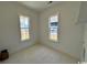 Bright bedroom featuring two windows and neutral tiled floors at 718 Macon Alley, Myrtle Beach, SC 29588