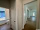 Bright hallway shows the transition from the half bathroom to the open-plan living space at 718 Macon Alley, Myrtle Beach, SC 29588