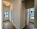 Spacious hallway featuring hardwood floors and white trim, leading to rooms with natural light at 718 Macon Alley, Myrtle Beach, SC 29588