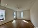 Spacious living room featuring hardwood floors, recessed lighting, and multiple large windows at 718 Macon Alley, Myrtle Beach, SC 29588