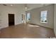 Spacious main bedroom boasts hardwood floors, three bright windows, and doorway to a walk-in closet at 718 Macon Alley, Myrtle Beach, SC 29588