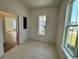 Practical mud room featuring tiled floor, natural light, and convenient access to other areas of the house at 718 Macon Alley, Myrtle Beach, SC 29588