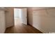 Walk-in closet with hardwood floors and shelving, offering ample storage space and organization at 718 Macon Alley, Myrtle Beach, SC 29588