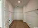 Empty walk-in closet features white shelving, hardwood floors, and ample storage potential at 718 Macon Alley, Myrtle Beach, SC 29588