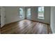 Bright bedroom with hardwood floors and a view of the neighborhood at 734 Macon Alley, Myrtle Beach, SC 29588