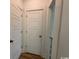 Hallway featuring white trim, a door, and hardwood floors at 734 Macon Alley, Myrtle Beach, SC 29588