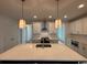 Spacious kitchen with an island, pendant lighting, stainless steel appliances, and white cabinetry at 734 Macon Alley, Myrtle Beach, SC 29588