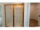Modern bathroom featuring a glass-enclosed shower with subway tile and gold hardware at 734 Macon Alley, Myrtle Beach, SC 29588