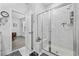 Elegant bathroom with a large walk-in shower and marble tile at 2523 Blue Crane Circle # 102, Myrtle Beach, SC 29577