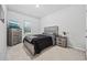Bedroom with a bed, dresser, and window, carpeted floor at 2523 Blue Crane Circle # 102, Myrtle Beach, SC 29577