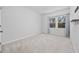 Simple bedroom with carpeted floor and a large window at 2523 Blue Crane Circle # 102, Myrtle Beach, SC 29577