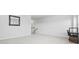 Bright bonus room with carpeted floor, large windows and a workspace at 2523 Blue Crane Circle # 102, Myrtle Beach, SC 29577