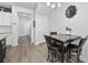 Small dining area with a dark wood table and four black chairs at 2523 Blue Crane Circle # 102, Myrtle Beach, SC 29577