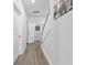 Bright hallway with hardwood floors and access to upstairs at 2523 Blue Crane Circle # 102, Myrtle Beach, SC 29577