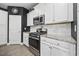 Well-equipped kitchen with granite countertops and stainless steel appliances at 2523 Blue Crane Circle # 102, Myrtle Beach, SC 29577