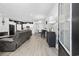 Open living room with hardwood floors and gray couches at 2523 Blue Crane Circle # 102, Myrtle Beach, SC 29577