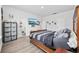 Spacious main bedroom with wood bed frame and en-suite bathroom at 2523 Blue Crane Circle # 102, Myrtle Beach, SC 29577