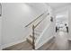 Modern staircase with light wood railings and dark hardwood floors at 2523 Blue Crane Circle # 102, Myrtle Beach, SC 29577