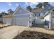 Exterior view of townhouses showcasing garage and walkway at 2523 Blue Crane Circle # 102, Myrtle Beach, SC 29577