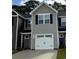 Charming townhome with attached garage and neutral siding, showcasing its inviting facade at 261 Christiana Ln. # C, Myrtle Beach, SC 29579